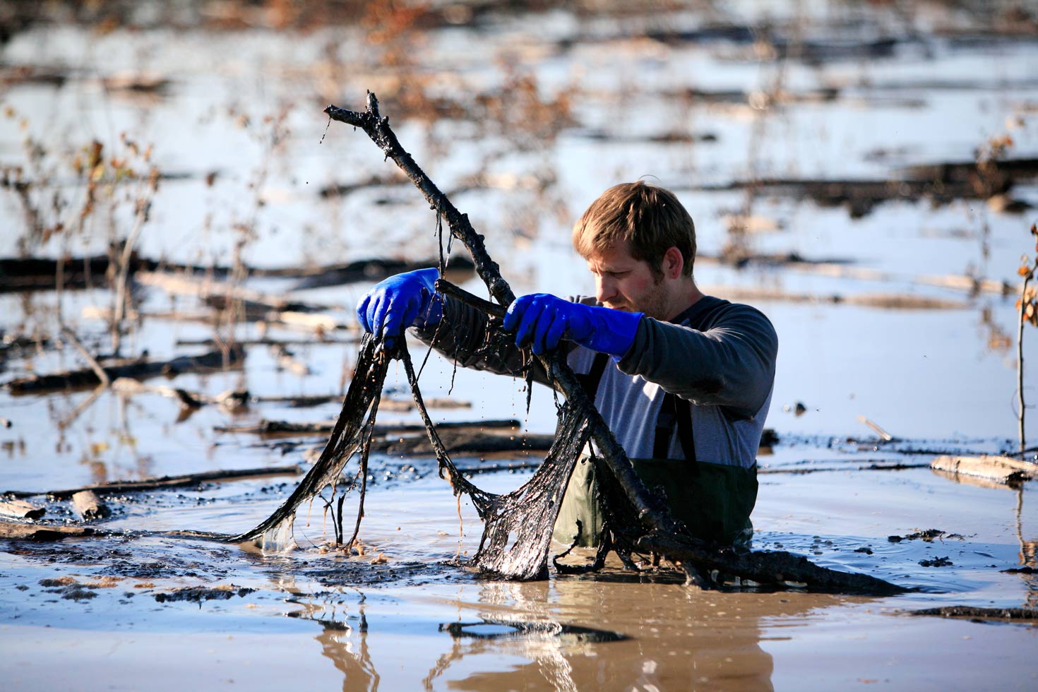 Greenpeace Canada action coordinator Kenneth Lowyck and volunteer Terry Christenson collect water and soil samples from the tailings pond of the tar sands mining site of CNRL (Canadian Natural Resources Limited) Horizon north of Fort McMurray, northern Alberta, 2009