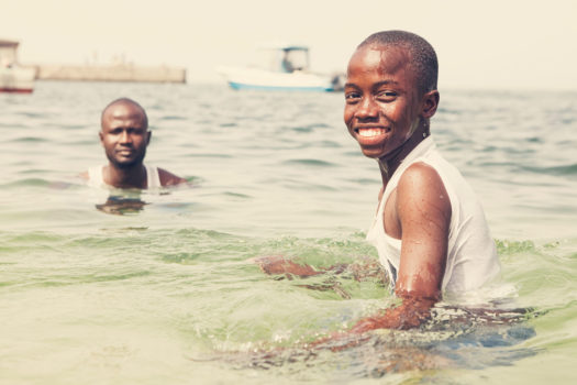 Baby Dia takes a swim on Goree Island