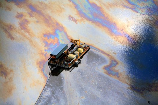 Aerial view of oily surface on the Mildred Lake tailings pond adjacent to the Syncrude upgrader, north of Fort McMurray, Alberta, 2009