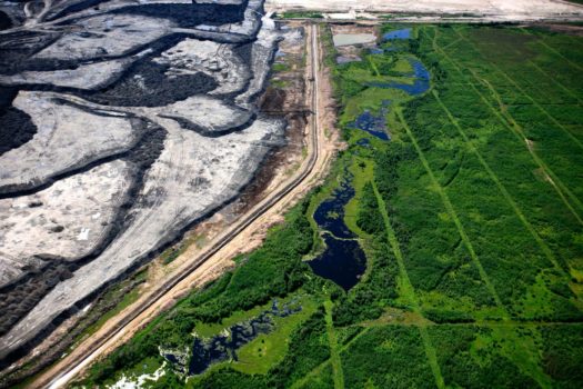 Aerial view of seismic lines and a tar sands mine in the boreal forest north of Fort McMurray, Alberta, 2009