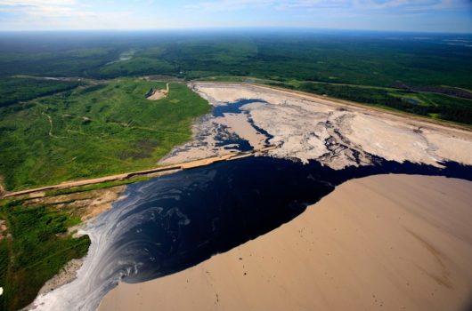 Aerial view of Suncor's 'Millennium' tar sands mine, upgrader and tailings pond in the boreal forest north of Fort McMurray, Alberta, 2009