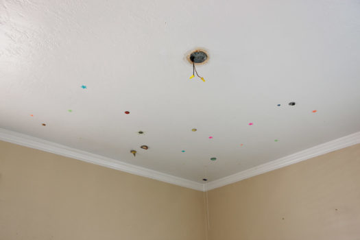 Foreclosure, USA: Galaxy, 2009

Plastic stars, solar system stickers, and a missing light fixture on the ceiling of a foreclosed home.