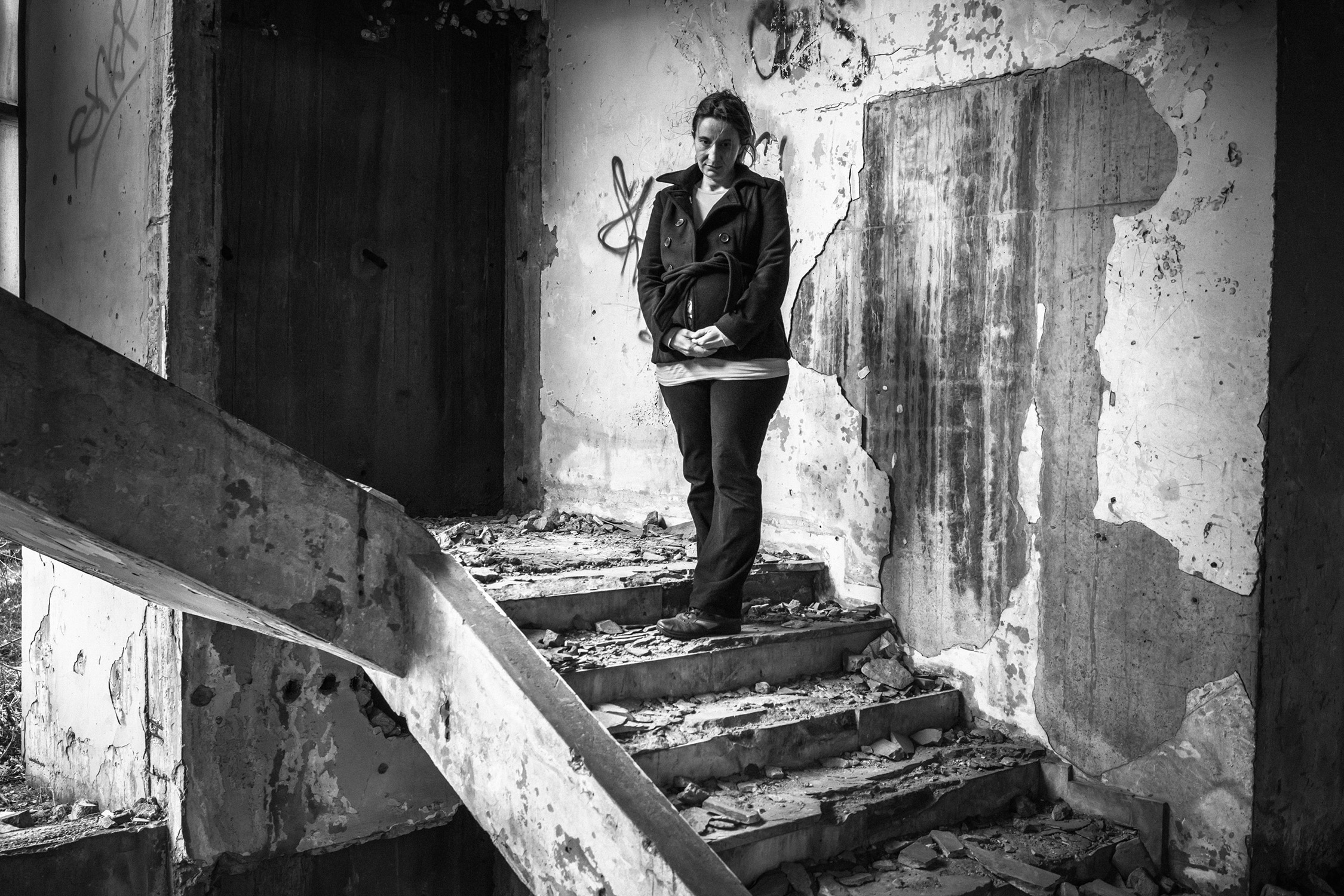 Sarajevo siege survivor Tanya Kresnjo in a bombed-out building stairwell.

Bosnia and Herzegovina.