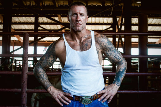 Joe,  #509080, is serving life with no chance of parole for second degree murder. He is the reigning Angola Prison Rodeo Champion and dons a belt buckle to prove it. "I don't have a pectoral muscle in my left shoulder. It got gored out a few years back by one of these bulls," he told me. "Last week, I won the pinball: last man standing in the hoop while the bulls charge us! Today, I'm going for 'Guts and Glory' prize. That's where they put the chip on the bull's forehead and we have to try get it. It's $500 if you can pluck that chip." I told him that sounds dangerous, to which he replies, "Yeah, but what else am I gonna do? [That's] a lot of money in Angola!"
