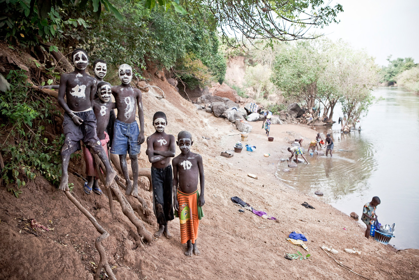 Young boys pose for a portrait on the banks of the River Gambia in Senegal. They said they had painted their faces like skulls for their own amusement.
