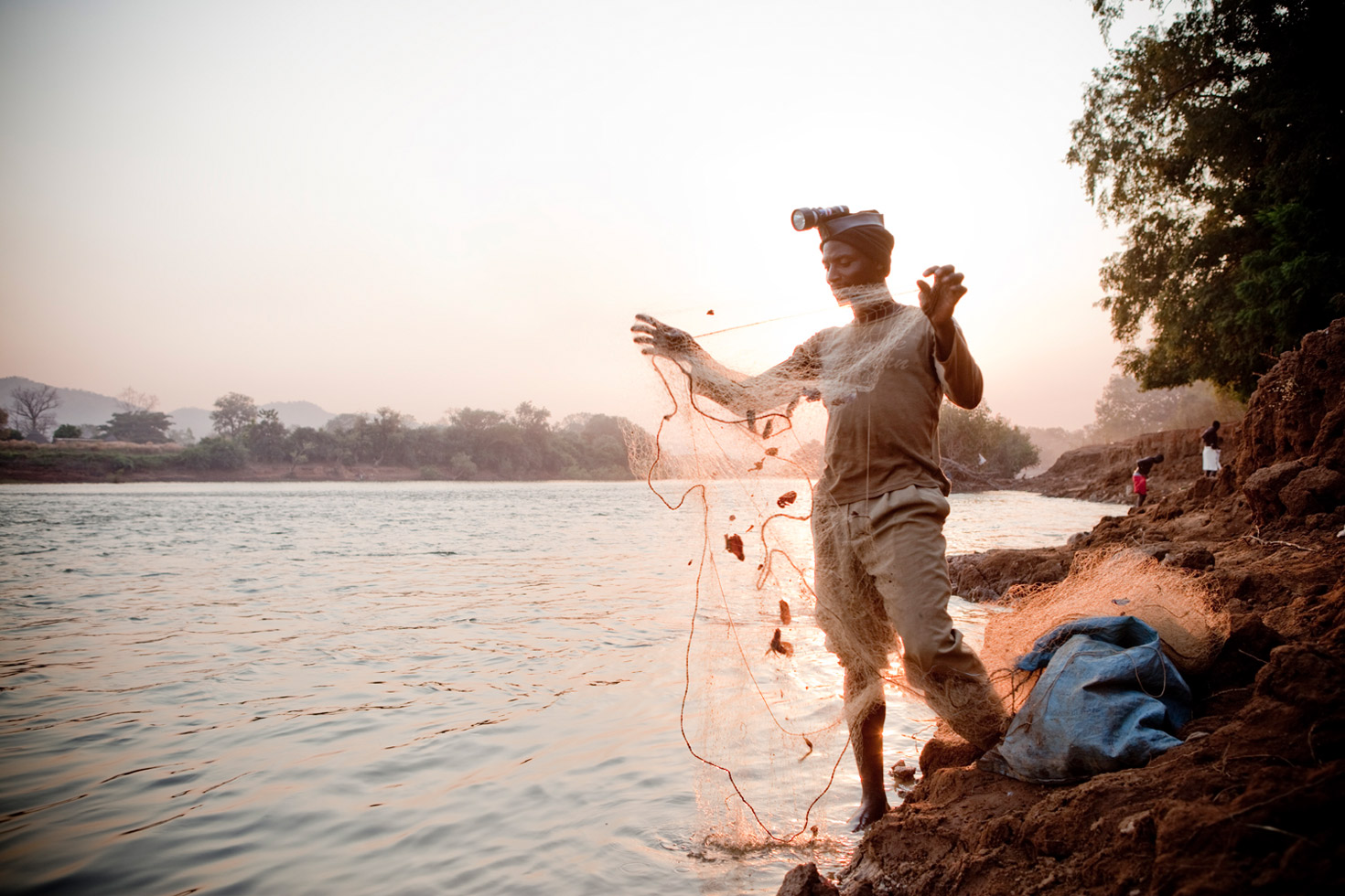 Malian fisherman and expedition guide Yousef Keita prepares his fishing nets at the village of Mako on the edge of Niokolo Koba National Park, Senegal.