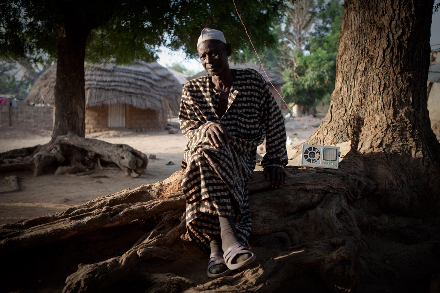 Bakary Dabo, the Alkalo (village chief) of Diagabu Tenda, a small settlement on the banks of the River Gambia. The position is unpaid, and the Alkalo is responsible for negotiating disputes, giving land rights and also to be the host and protector of visitors to his village.