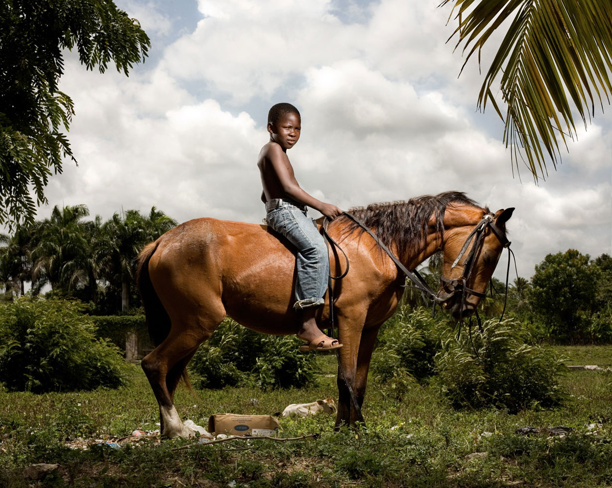 Oscar, 8-years-old, works with his father in the fields every day, tending to their animals. Their five goats, two cows, two horses and five chickens serve as a form of insurance. This horse, valued at 4,000 pesos ($120), would only be sold in the case of a family emergency. Oscar's mother runs a community store, which provides the family's modest income.