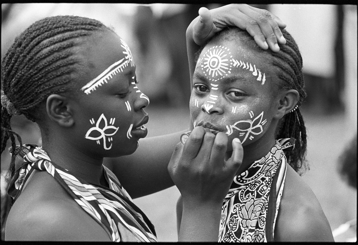 "She who spends time adorning herself knows she is going to dance." Kenyan proverb

Young dancers make up their faces in preparation for a dance. Many schools have extracurricular activities encouraging music, dance, and drama.

Kwangware Primary School Dancers, Nairobi, Kenya, 1990