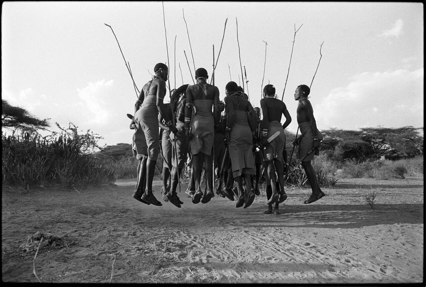 "If you can talk, you can sing, if you can walk, you can dance." Zimbabwean proverb

Maasai men dancing a traditional warrior dance. 

Northern Kenya, 1990