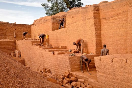 Villagers mix the water with clay in small pits and shovel the material into tin molds. The bricks bake in the hot sun. As they dry they are rotated and turned on end, often creating fascinating patterns.