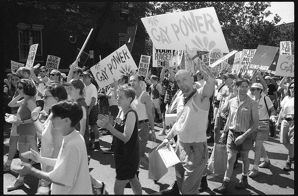 “Gay Power” signs are mock-ups/recreations of the same signs used at the first Christopher Street Liberation Day (i.e. Pride) parade in 1970. ACT UP March, Stonewall 25th Anniversary, June 26, 1994.