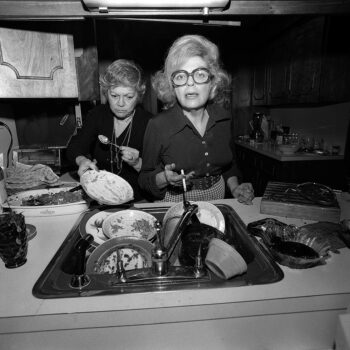“Enough with the pictures” Mom and Aunt Evelyn doing Thanksgiving dishes, North Massapequa, 1975