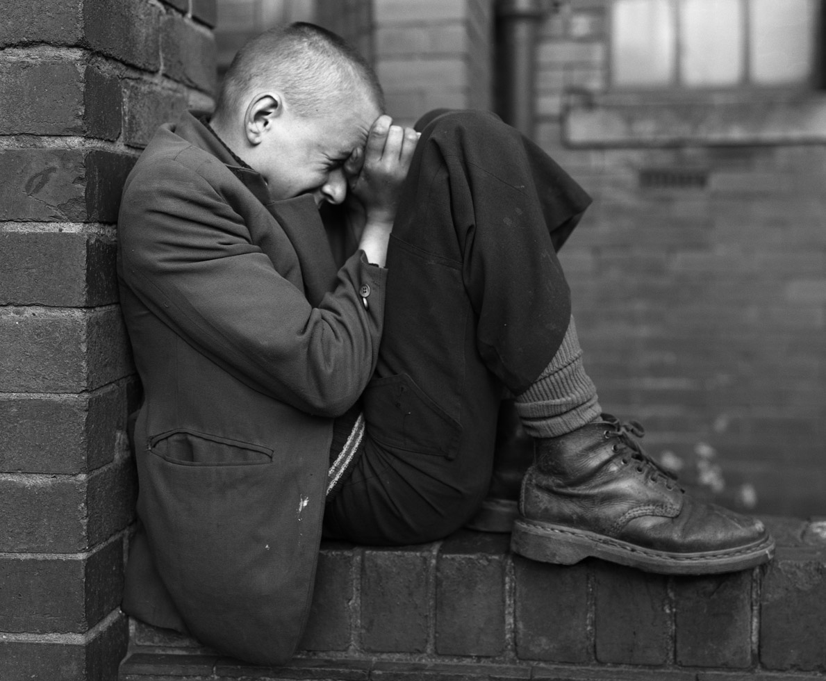 Youth on wall, Jarrow, Tyneside, 1976
