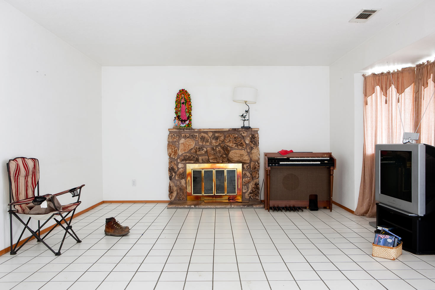 Stockton, California.
Foreclosure, USA: Triny's House, 2009

Triny and her family slowly removed their belongings as their home was being lost to foreclosure. She and her husband and their young daughter moved in with her parents. Later that year her brother-in-law lost his home to foreclosure and also had to move in with Triny's parents. The six of them live together in a small home to this day.