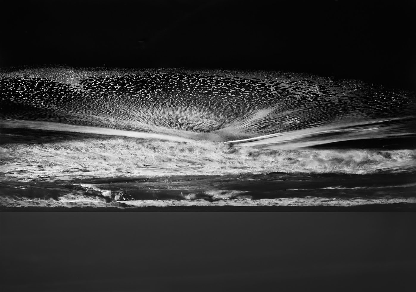 Approach the edge and dip your toes in the sky. 
Michael Massaia's latest distortions reflect the upside down view he sees in the ground glass of his 5 x 7 camera's lens.