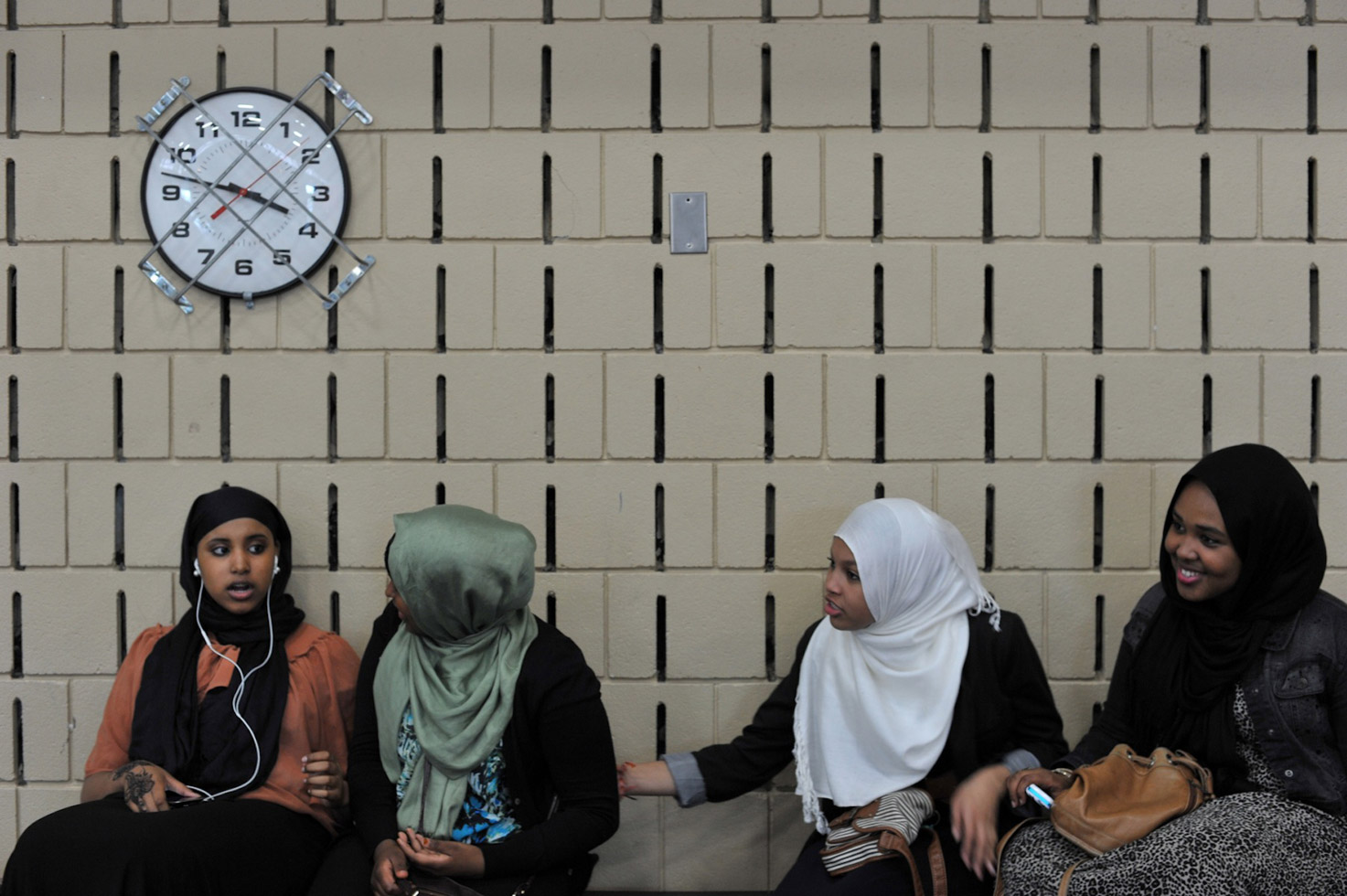 Young Somali women joke around at a basketball game in Minneapolis. The game was organized to fund-raise for those effected by the 2011-2012 famine in Somalia.