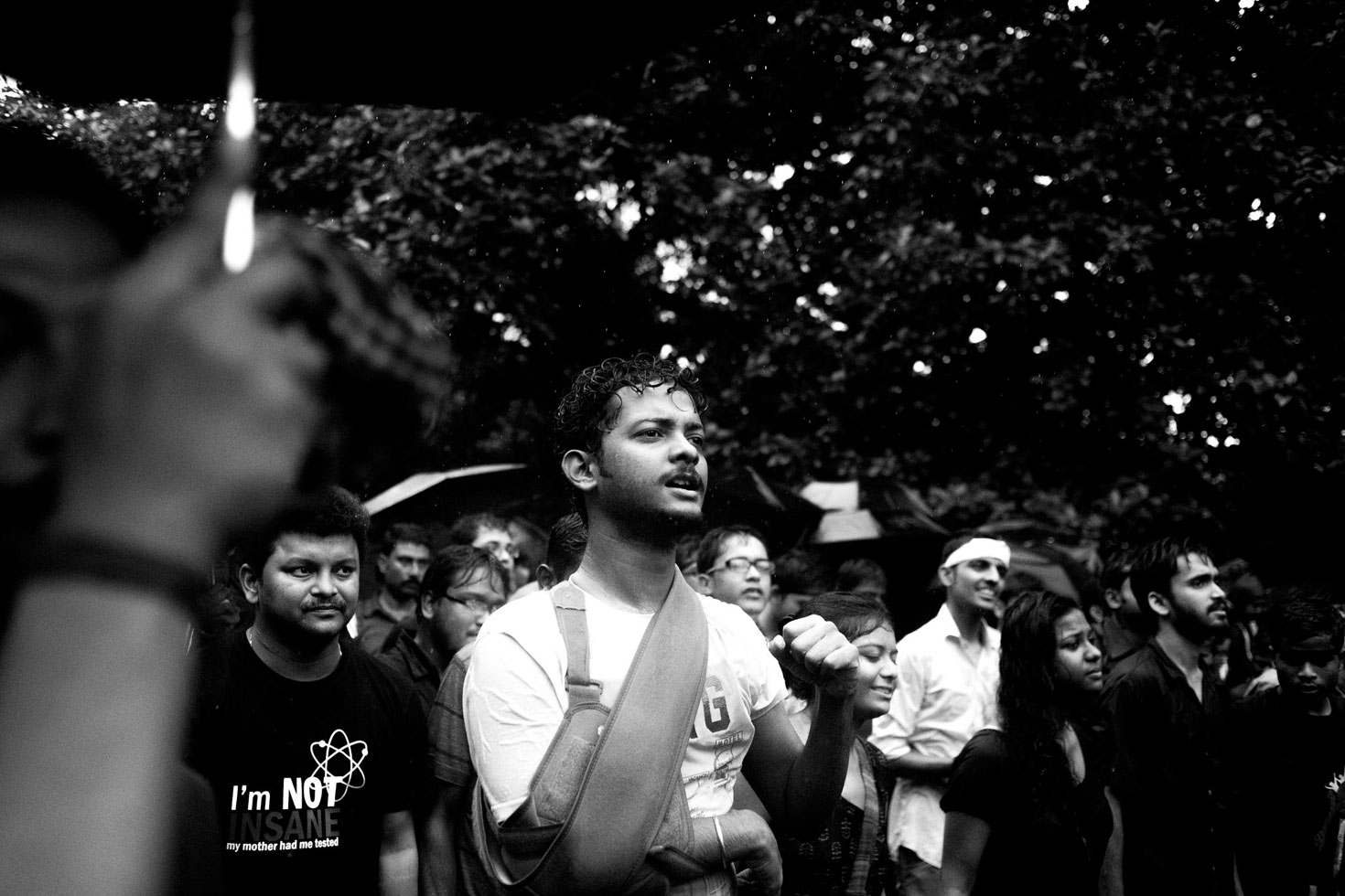 "Tanumay Naskar is the name of the student in the frame. The police broke his arm and smashed him in his ribs with bamboo sticks on that dark night."