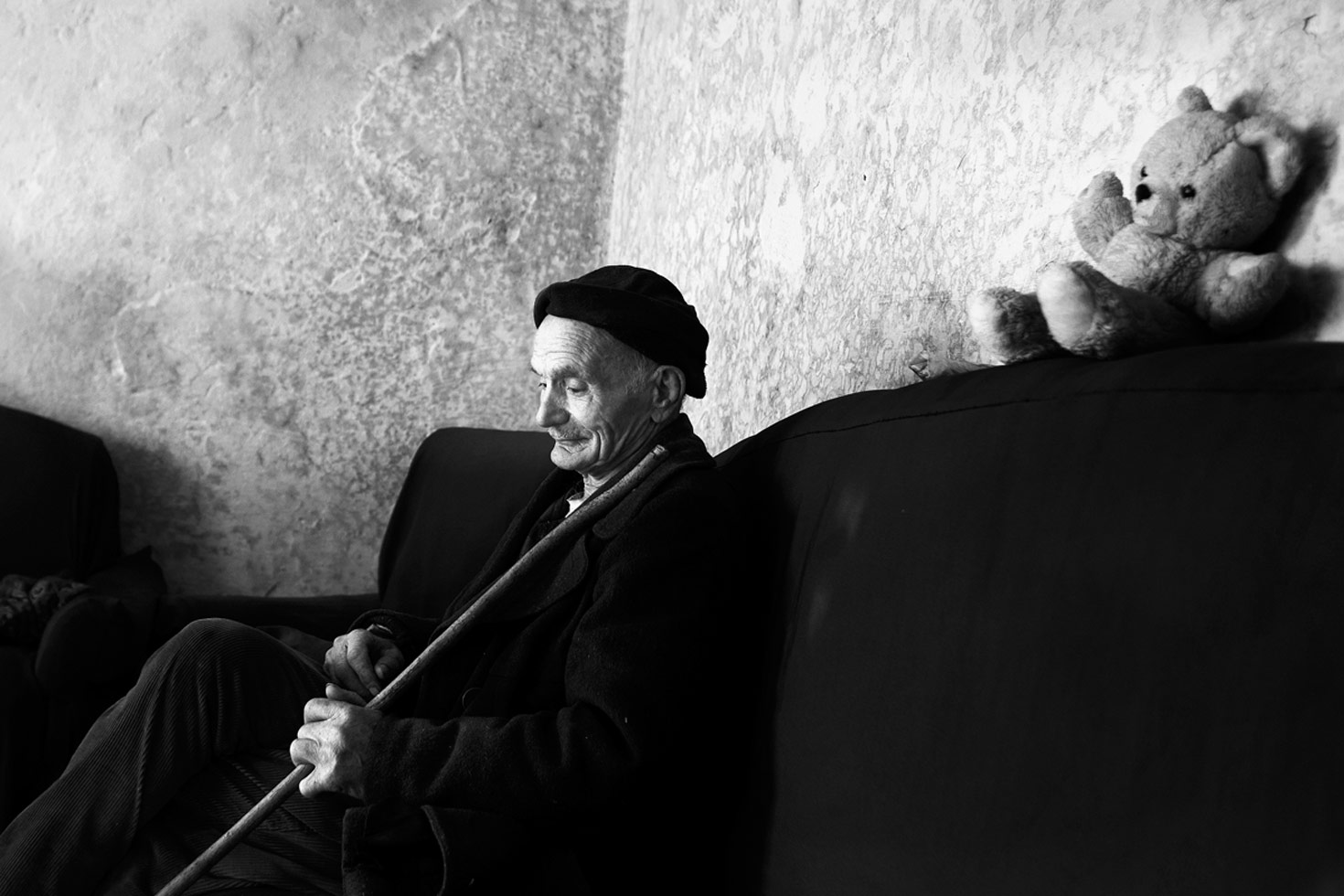 A man in his neighbor's house.

Shkoder, Albania, 2012