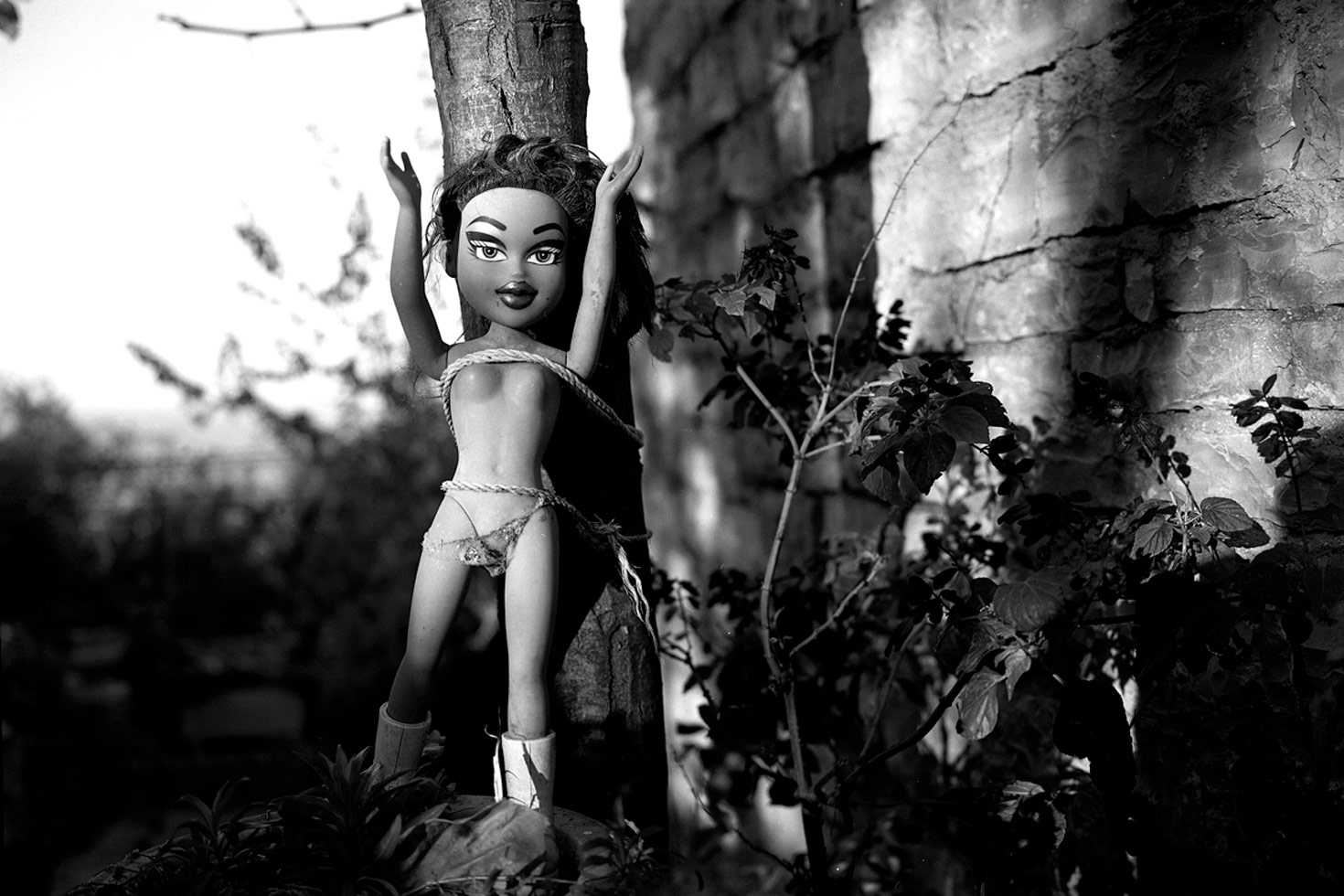 A doll strung to a tree. People believe this will remove negative energies from their home and family.

Shkoder, Albania, 2009