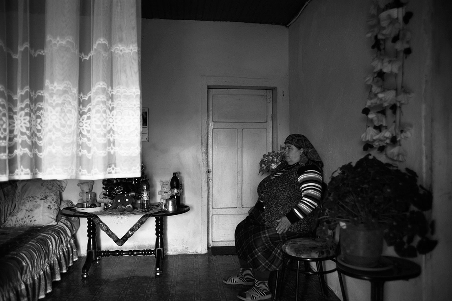 A woman living alone in her house. All the men of the family have fled to safety - they are targets of a 'Gjakmarrja,' a blood feud. The Kanun, a set of traditional Albanian laws, which has a powerful hold in this area, stipulates that only men can be killed, so the woman is safe.

Shkoder, Albania, 2012
