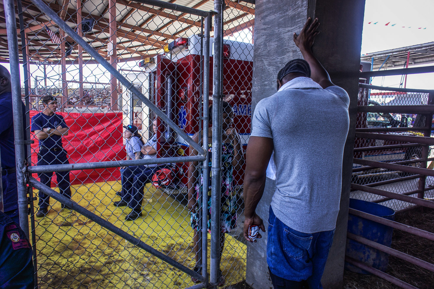 An inmate takes a moment before changing into his stripes and taking part in the rodeo.
