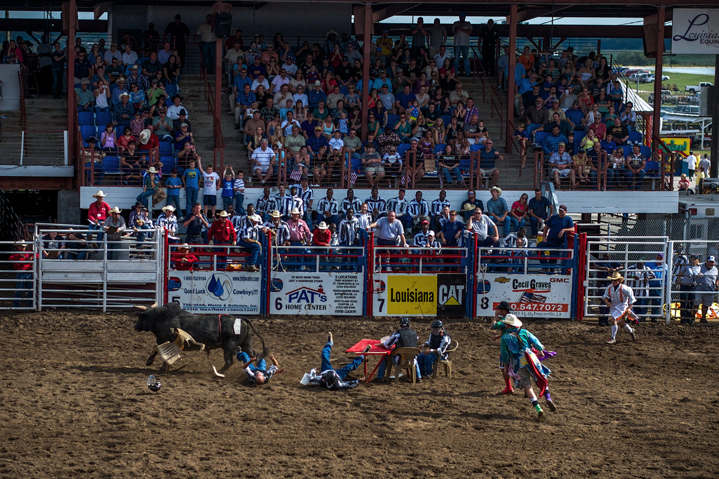 A bull rammed the 'convict Poker' table, where the last man sitting wins $100. One inmate, Jamie, told us, "We are lining up to participate. It's exciting knowing we are messing with these bulls. These animals are 1,800 pounds and so you gotta be real careful. These bulls take NO prisoners, even though we are prisoners. It's about taking part... and hopefully winning some money!"