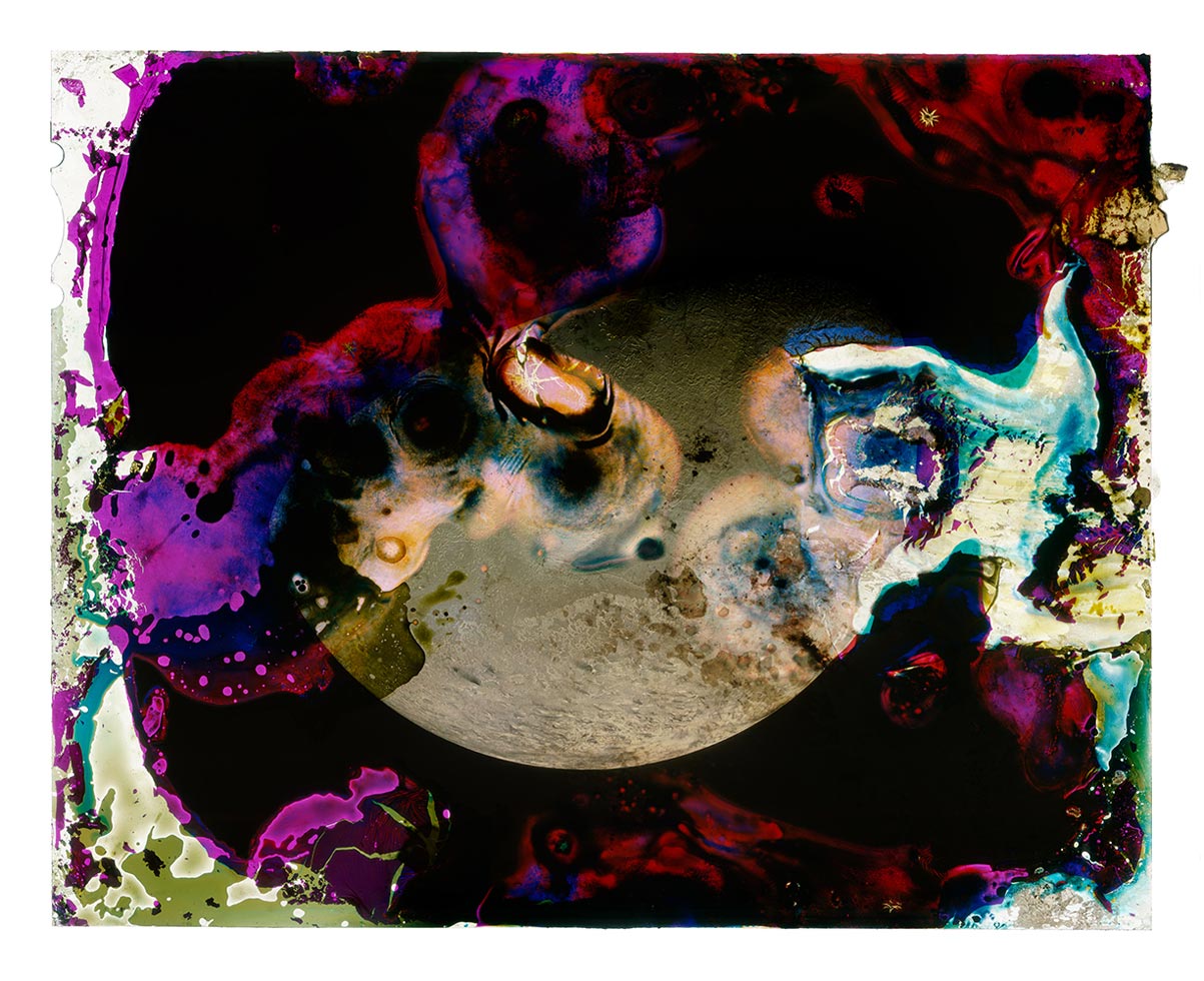 A Photograph of Saturn's Moon Titan Eaten by Bacteria Found on the Sticky Red Stain in My Freezer