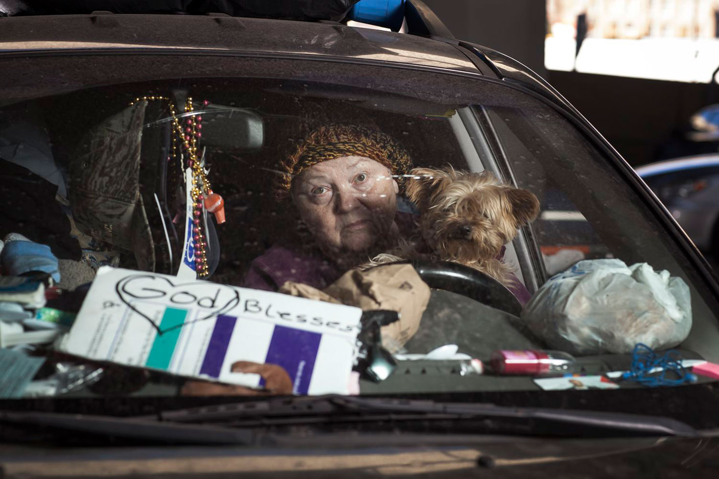 Rescue Mission Camp, New Orleans, Louisiana, 2014. 
Carol lived in a van with her dog Molly. She drove to New Orleans from Iowa with the hope of a milder winter. While living in her van there was no room to sleep since it was full of her belongings. Her days were spent at the steering wheel. At night she would empty a space in the back to sleep by putting her belongings on the street. From the van she briefly moved into a storage locker before she was placed in an apartment by social services.