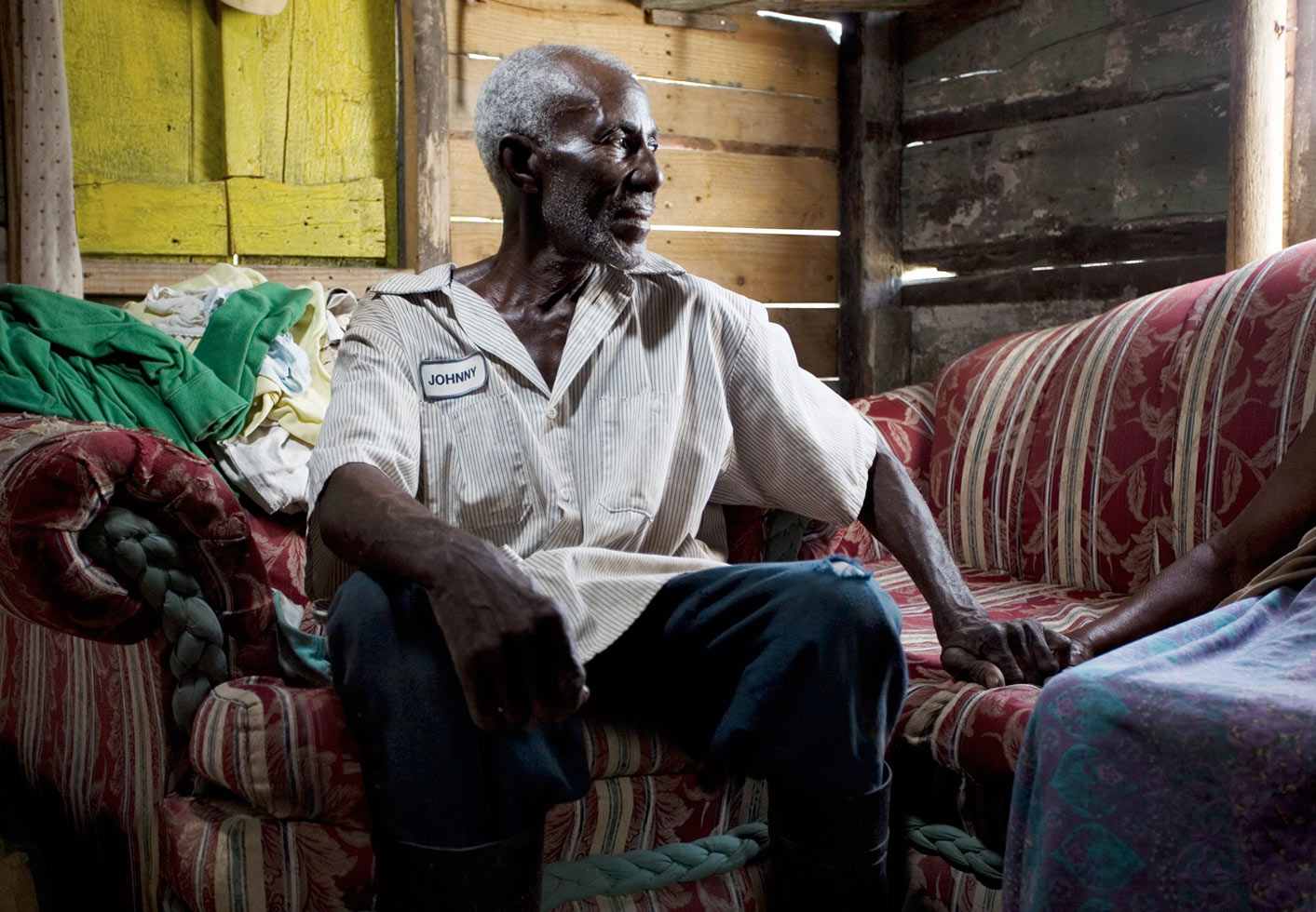 Dato, 71, and his wife, were born in Haiti. In 1970, he came to cut sugar cane in the Dominican Republic. Shortly after, he sent a guagua (minibus) to bring his wife to join him in the new, prosperous country. They have been married for more than 50 years and now live with their 6-year-old grandchild.