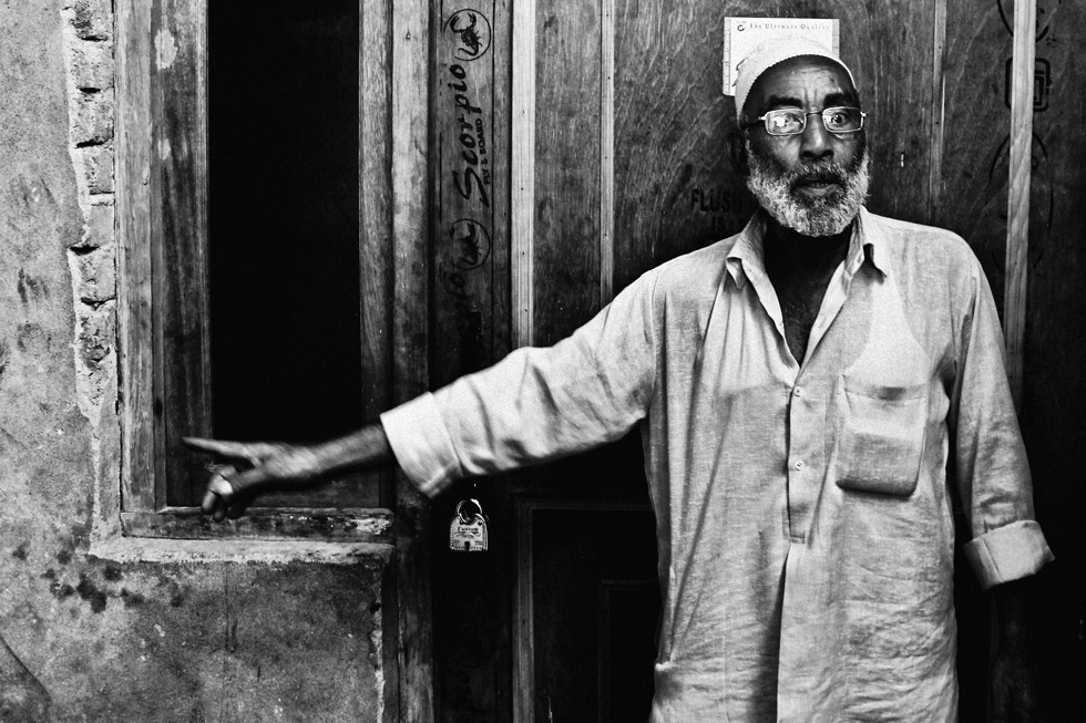 Mohammad Salim, father of Shahnawaz Qureshi, points to where his son was murdered.