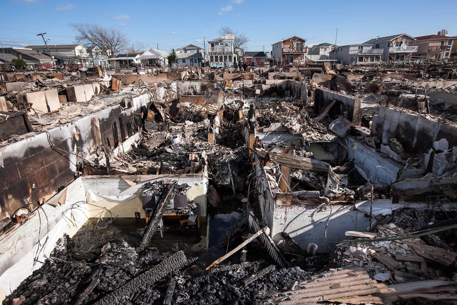 Over the course of five days beginning October 22, 2012, a storm developed in the Caribbean Sea that would ultimately kill at least 286 people in seven countries. Hurricane Sandy hit New York on October 29, and New York-based Natan Dvir photographed the immediate aftermath. He recently returned at similar times of the day, under commission by The Weather Channel, to the exact locations, to show what has happened since.

Breezy Point, Queens, November 4, 2012