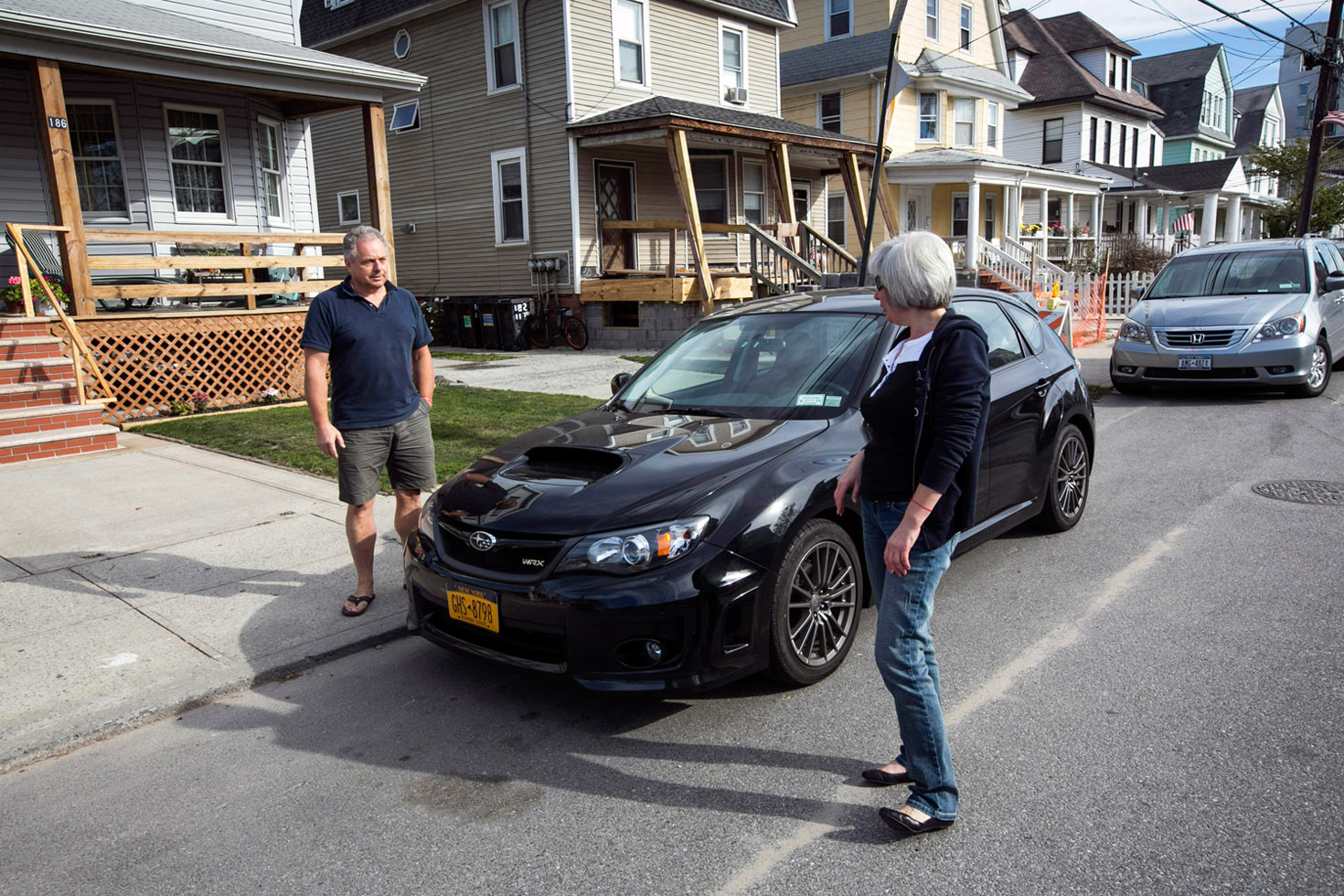 Gregory Piechocki and Vicky Shteyn next to their homes on Beach 119th Street, Rockaway, Queens, October 14, 2013