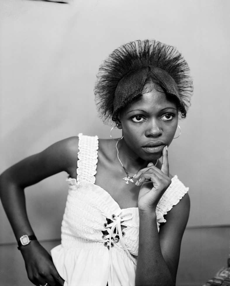 Pomona, Los Angeles County Fair, 1977
	
When she came back a year later, I didn't recognize her. She had a young child, her hair was pulled back conservatively and she was wearing fine clothes. She politely asked me to call when the book was published. She left a snapshot of herself with her phone number on the back.