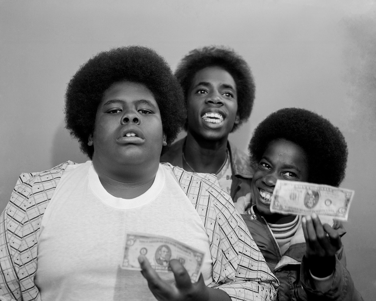 Pomona, Los Angeles County Fair, 1977
	
Some customers flashed big bills and loads of money. These kids had to dig deep in their pockets to find some old, wrinkled bills to show.