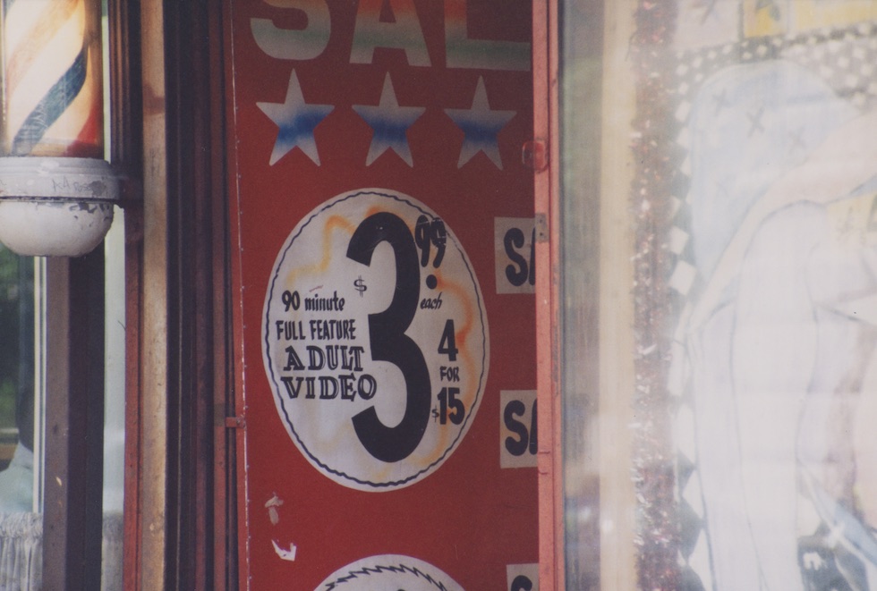 Robert Iulo 
"Bare Elegance Topless Bar and Lounge building signage, 216 West 50th Street" 1998

Chromogenic development print. Museum of the City of New York. Gift of Robert Iulo.