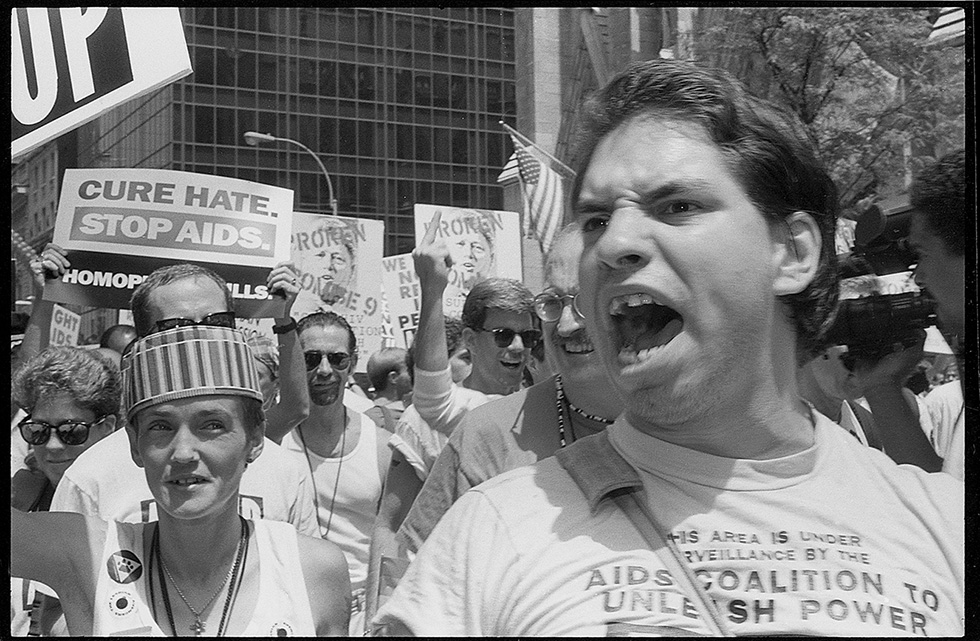 ACT UP March, Stonewall 25th Anniversary, June 26, 1994.

"Made between 1992-1994, these photographs provide an intimate look at New Yorkers' engagement in AIDS activism and the fight for LGBTQ+ rights. Diverse groups of New Yorkers came together for the collective cause of civil rights. At political funerals, marches, protests, parades, community centers, the people I photographed were aware of how media representation would define them. They were active participants in the making of these images." Meg Handler, 2022