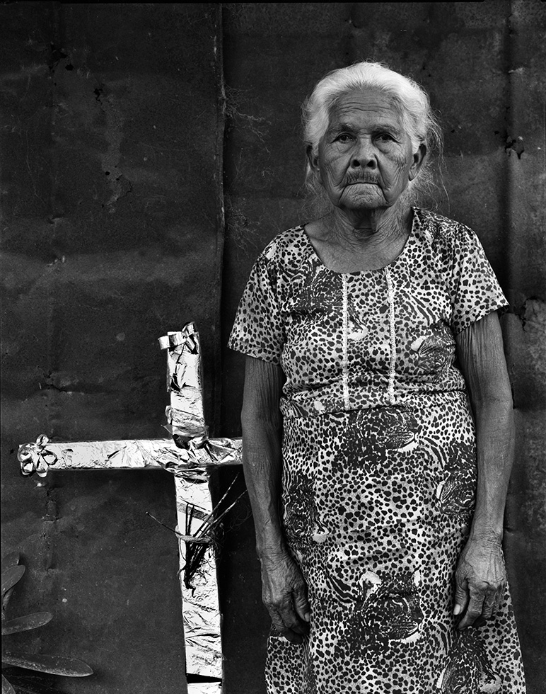 Ramona, 75. Ramona's front door crucifix is a typical display of religious faith in Larreynaga.