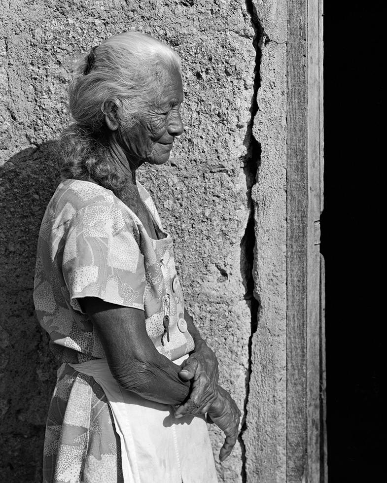 Socorro, 81. Socorro was one of the kindest and most gentle people I photographed. When I asked her what the key pinned to her dress was for, she answered, "It is for all my precious possessions, to keep them safe, especially the gift of my heart." The translation of her name, "Socorro," is "help."